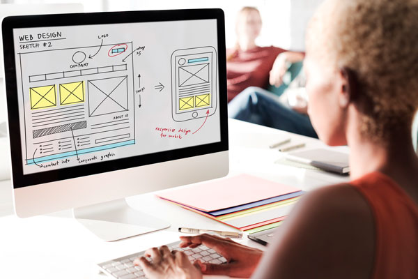 Web design wireframe displayed on computer screen